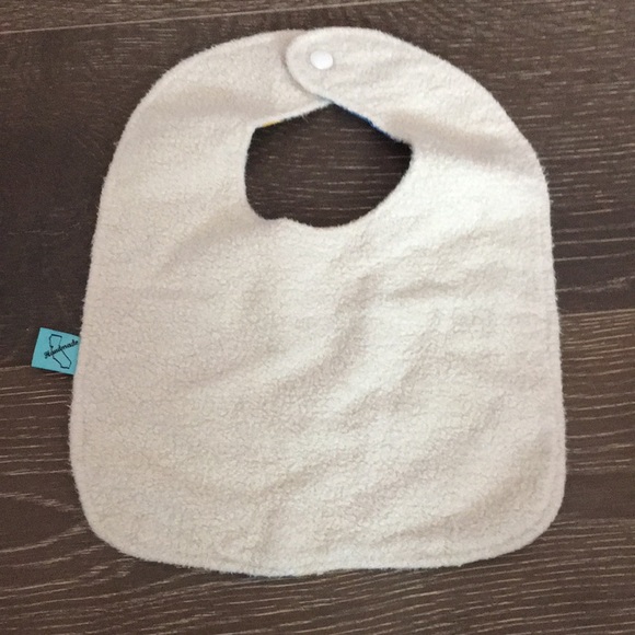 UCLA baby bib. Snap closure. Minor blemish on front. Soft material on backing. - Picture 2 of 2